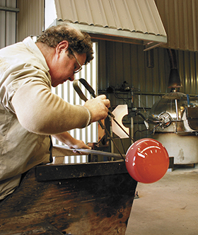 Student working in ECU glass studio.  Image: Mike Gray