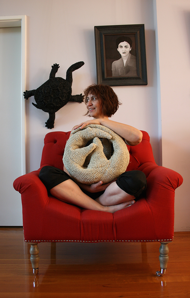 Mikaela Castledine in red chair, 2015. Image courtesy of the artist.